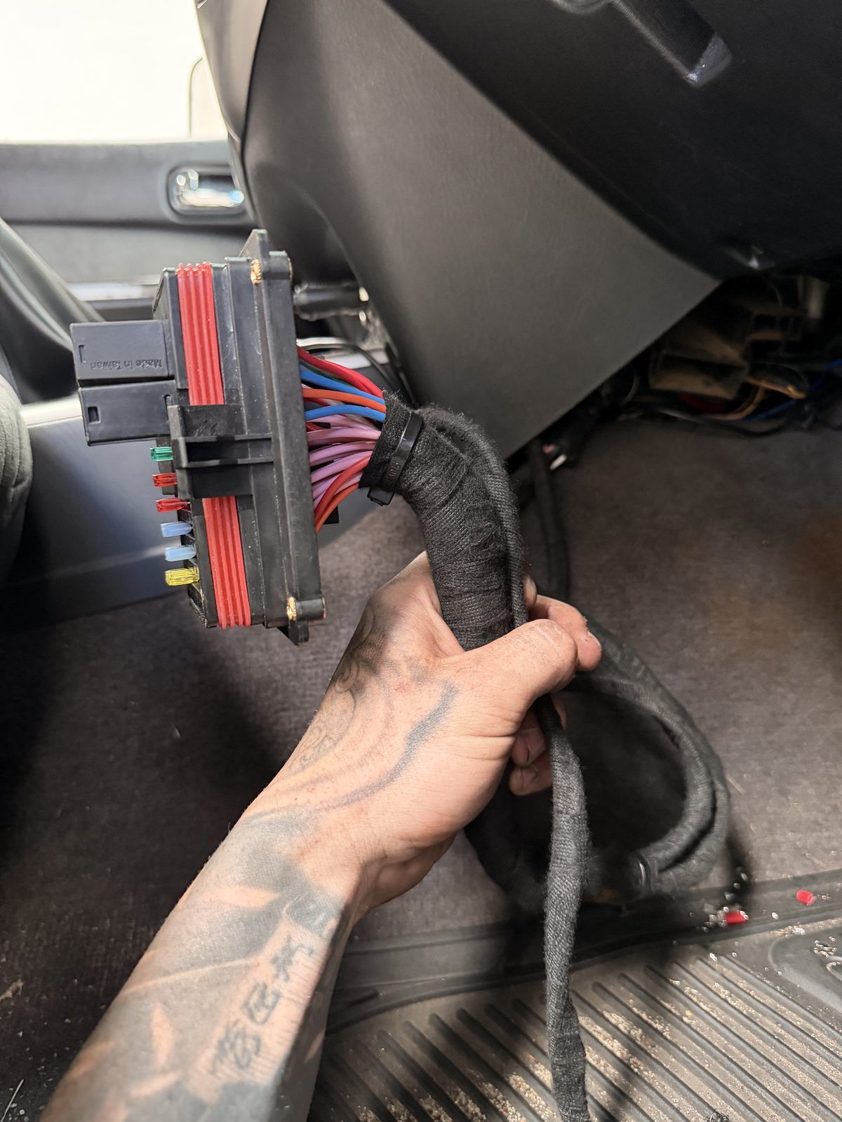Fused accessory harness and relay box being installed