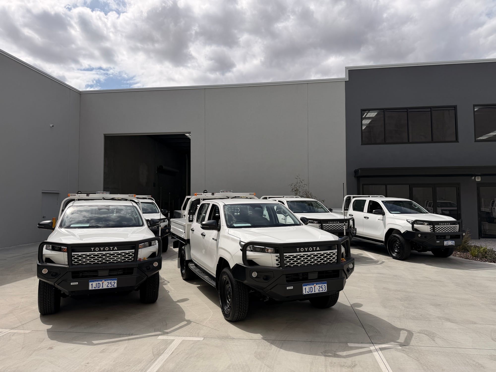 Fleet utes with bullbars parked out the front of the Wangara workshop
