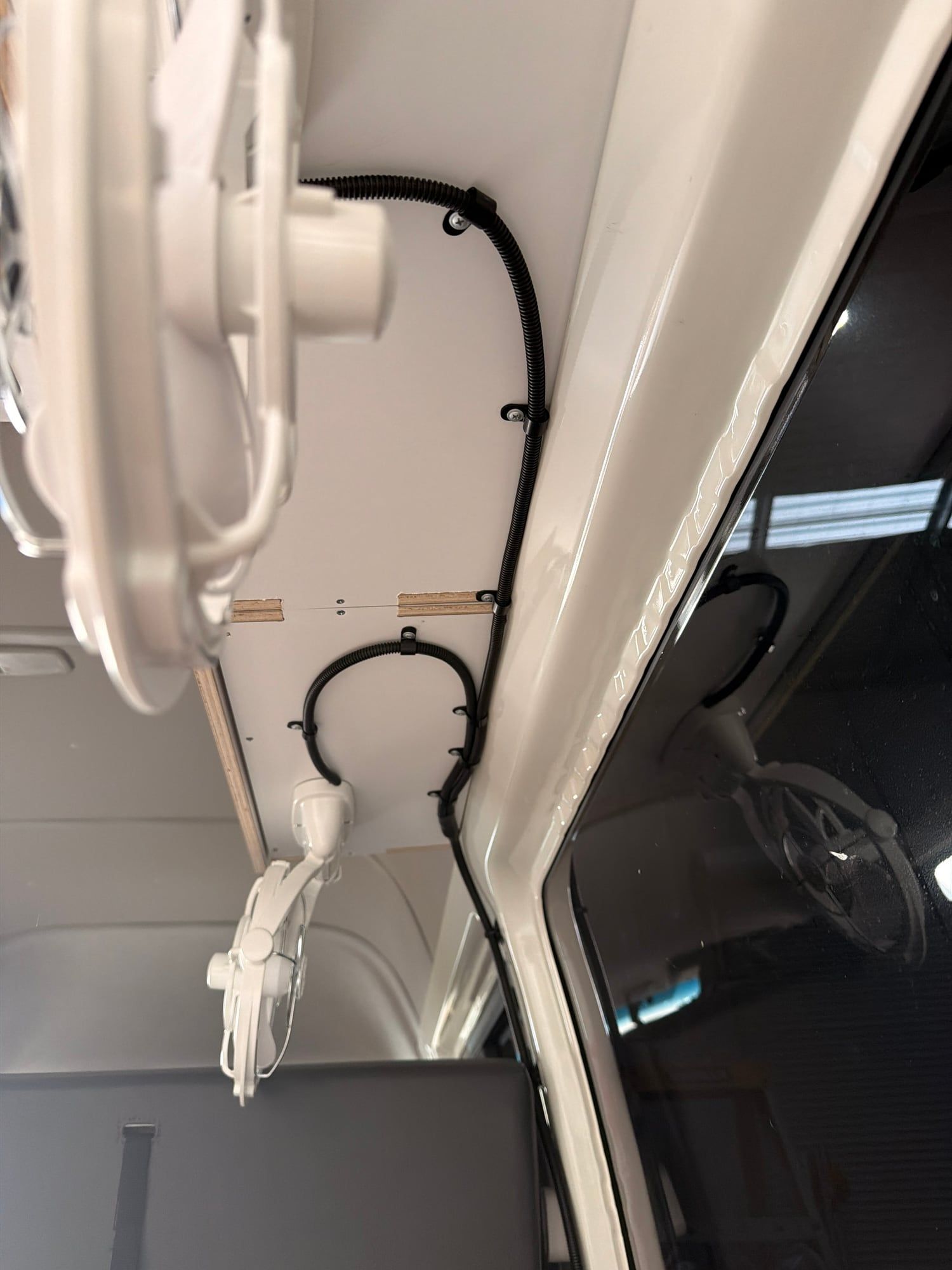 12V fan wiring run neatly along the roof of a HiAce
