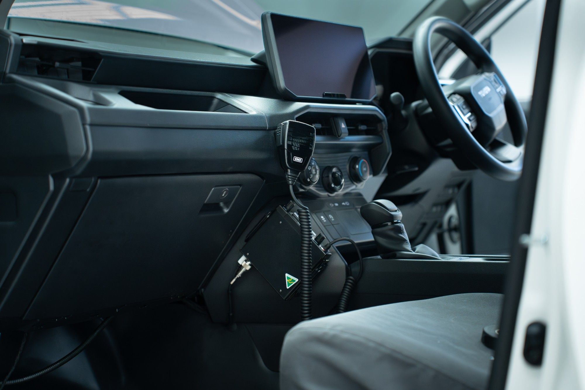 Neat UHF radio install in a Hilux cabin